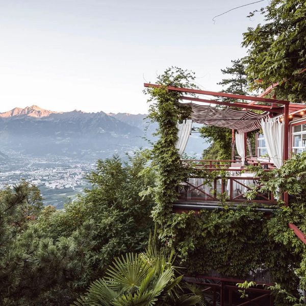 Illustrious. Exclusive. Privileged. Sat atop a mountain ledge overlooking Merano, Castel...